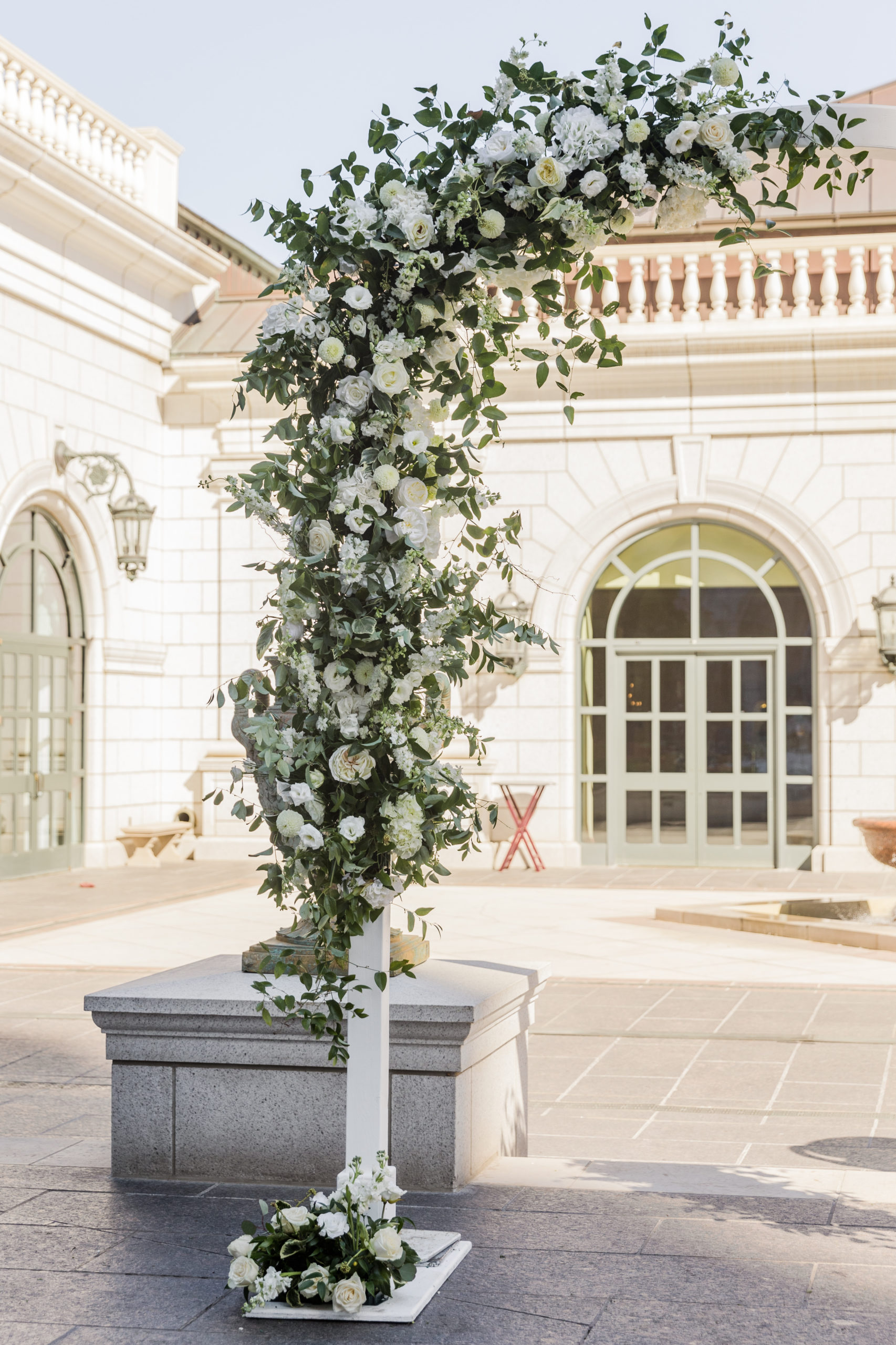 The stunning wedding arch lined with white roses for that luxurious feel, taken by Kyla Jeanette Photography