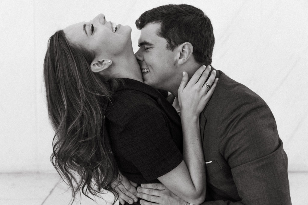 Black and white photo of Dana and David posing for their engagement shoot with Kyla Jeanette