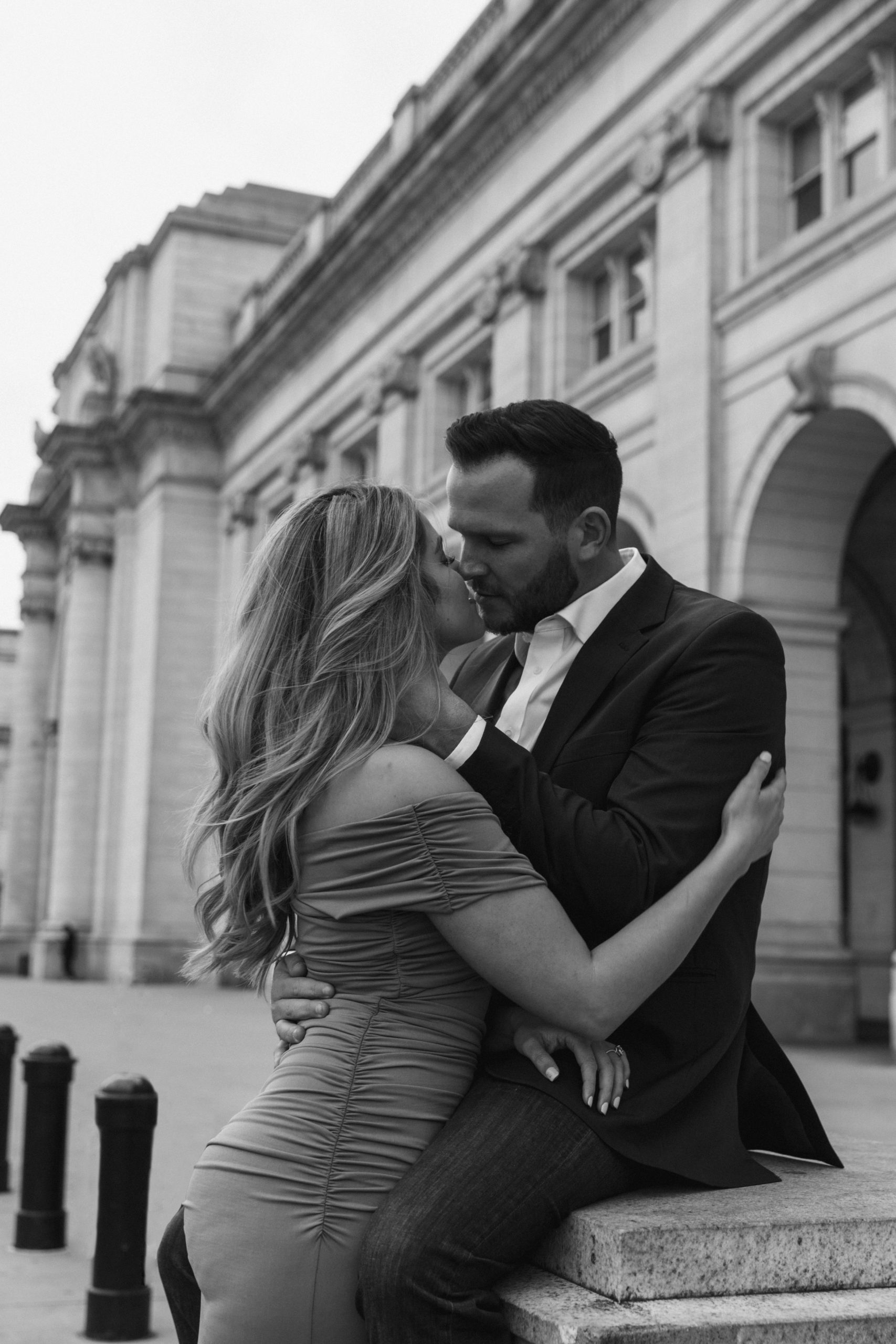 Close up of engaged couple embracing and kissing during their Union Station Photoshoot taken by Kyla Jeanette Photography