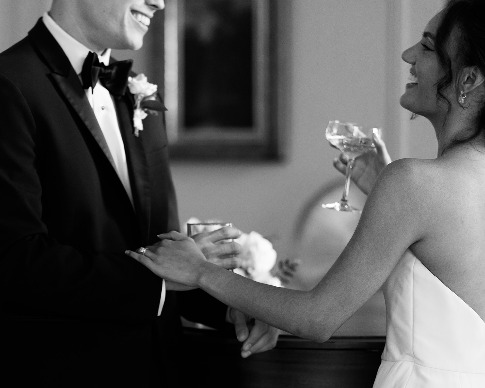 Black and white photo of bride and groom candidly posing during their wedding shoot with Kyla Jeanette Photography