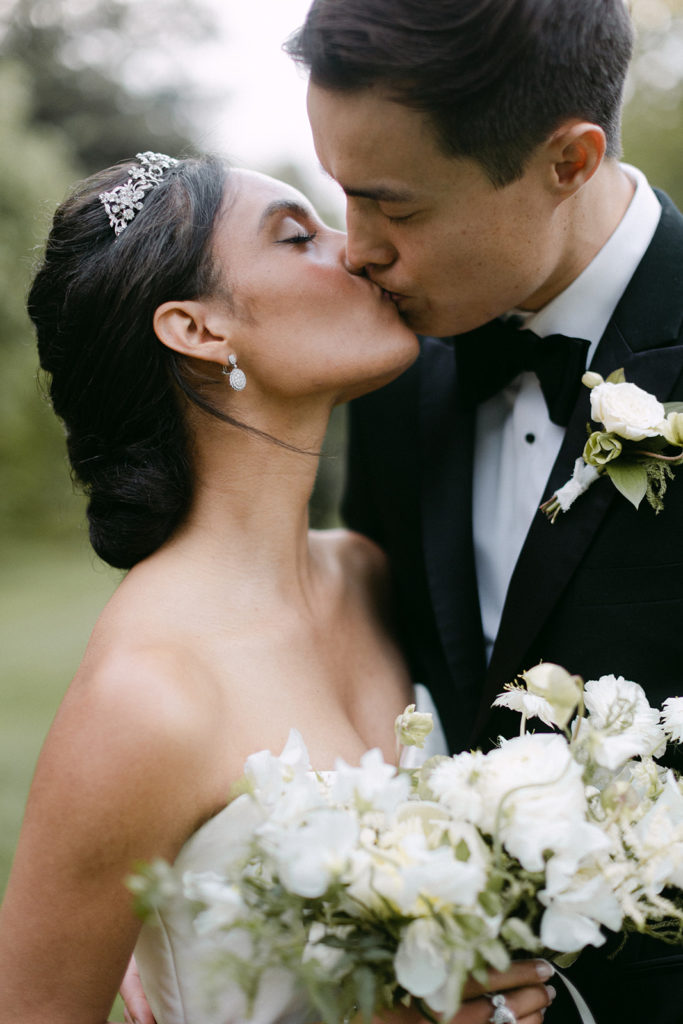 Bride and groom sharing a kiss during their wedding shoot with Kyla Jeanette Photography