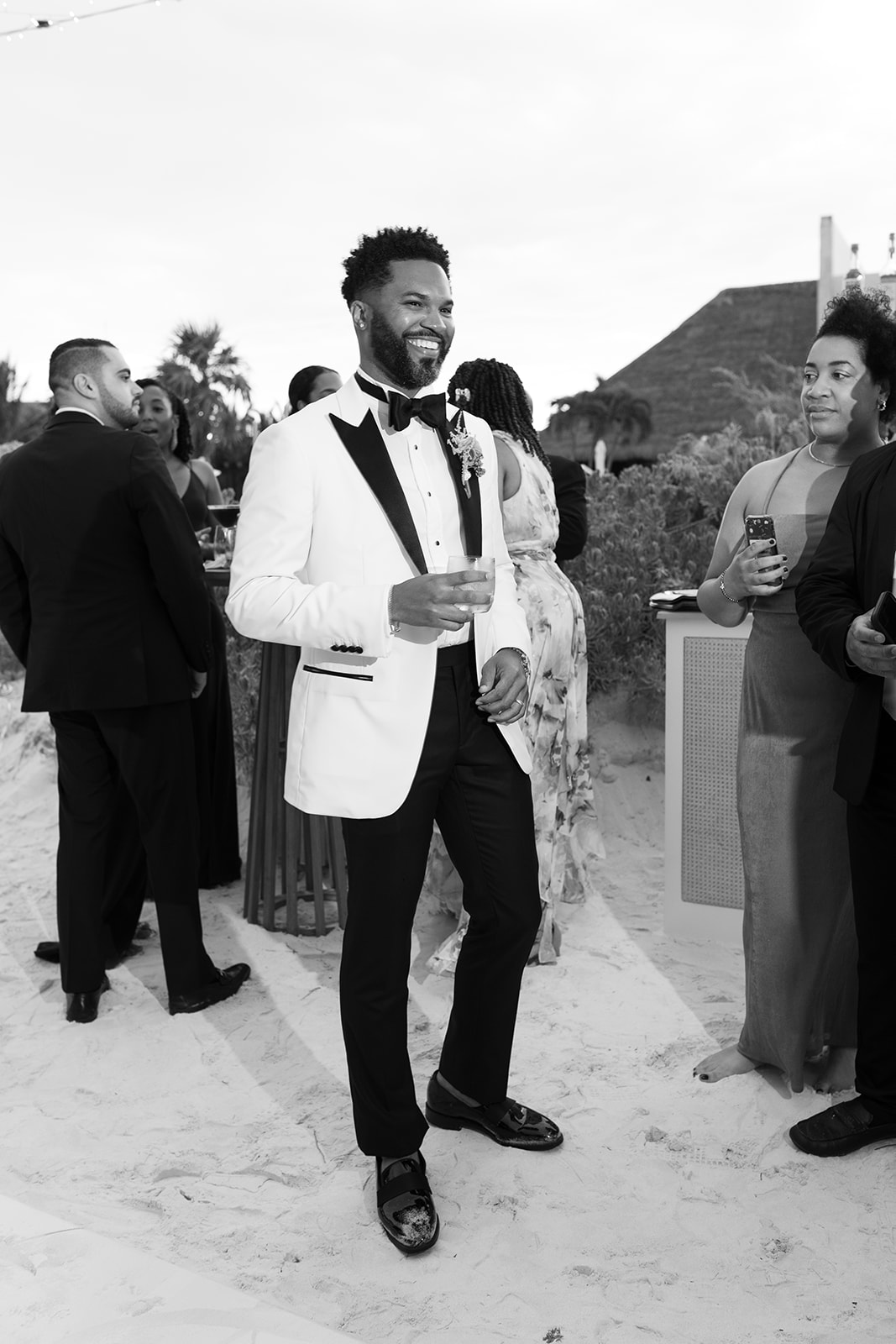 Lee in a tuxedo smiling
