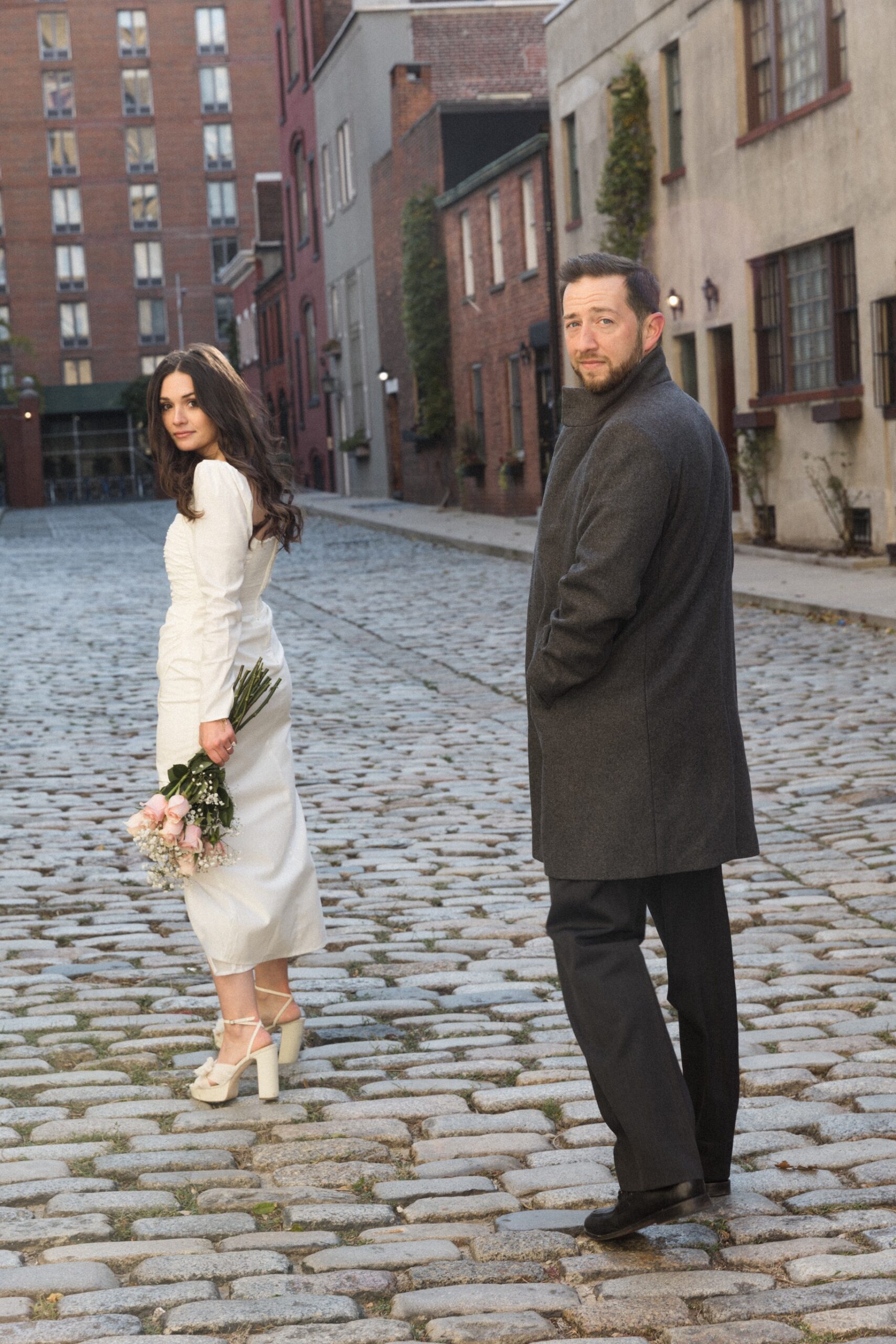 Kat and Vinny standing on a cobblestone street